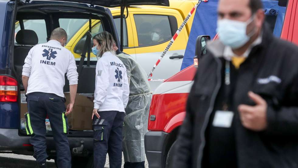 Elements of National Institute of Medical Emergency (INEM) prepares to make the pre-screening of patients who arrive by ambulance at Santa Maria Hospital in Lisbon, Portugal, 29 January 2021. On Thursday evening in declarations to journalists, the president of the board of directors of Northern Lisbon University Hospital Center, announced that from today a pre-screening of patients will be done to try to avoid so many ambulances stopped outside the hospital. TIAGO PETINGA/LUSA