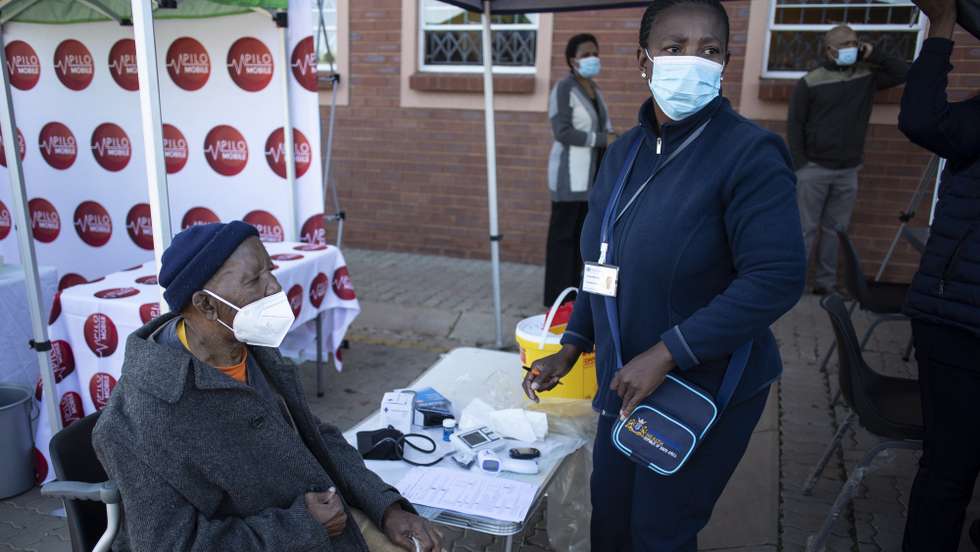 epa09206339 An elderly man has his pre-vaccine tests performed during the first day of Covid-19 vaccinations for the over 60 year old population in the country, in Johannesburg, South Africa, 17 May 2021. The first round of vaccinations was for the health care workers in the country. South Africa is lagging behind many countries in the world in its vaccination program.  EPA/Kim Ludbrook