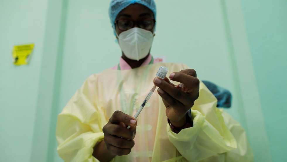epa09150875 Medical personnel prepare a Pfizer vaccine against covid-19 during a day of applying second doses to the population, at the Manuel Jose Hurtado school, in the Chorrillo neighborhood in Panama City, Panama, 21 April 2021. After the strong pandemic rebound at the end of 2020, Panama now exhibits 'control' of the covid-19, the director of the Metropolitan Health region, Israel Cedeno, told EFE on Wednesday, warning of an expected increase in cases in the short term due to the recent economic reopening. Panama accumulates at least 361,319 confirmed infections and 6,192 deaths from covid in just over a year of pandemic, and since last January 20 it has applied 569,277 doses of vaccine against the disease, all from the pharmaceutical company Pfizer.  EPA/Bienvenido Velasco