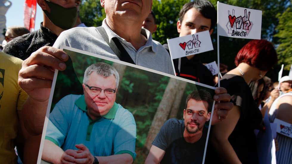 epa08580069 People hold a poster depicting presidential candidate Viktor Babaryko with his son during a campaign event of Belarusian opposition presidential candidate Svetlana Tikhanovskaya in Baranovichi, some 150 km from Minsk, Belarus, 02 August 2020. The presidential election in Belarus is scheduled to take place on 09 August 2020.  EPA/TATYANA ZENKOVICH