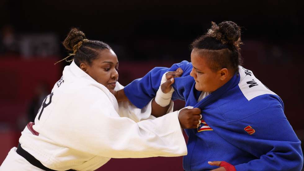 epa09378139 Melissa Mojica of Puerto Rico (blue) in action against Rochele Nunes of Portugal (white) during the Women -78kg Elimination Round of 32 at the Judo events of the Tokyo 2020 Olympic Games at the Nippon Budokan arena in Tokyo, Japan, 30 July 2021.  EPA/RITCHIE B. TONGO