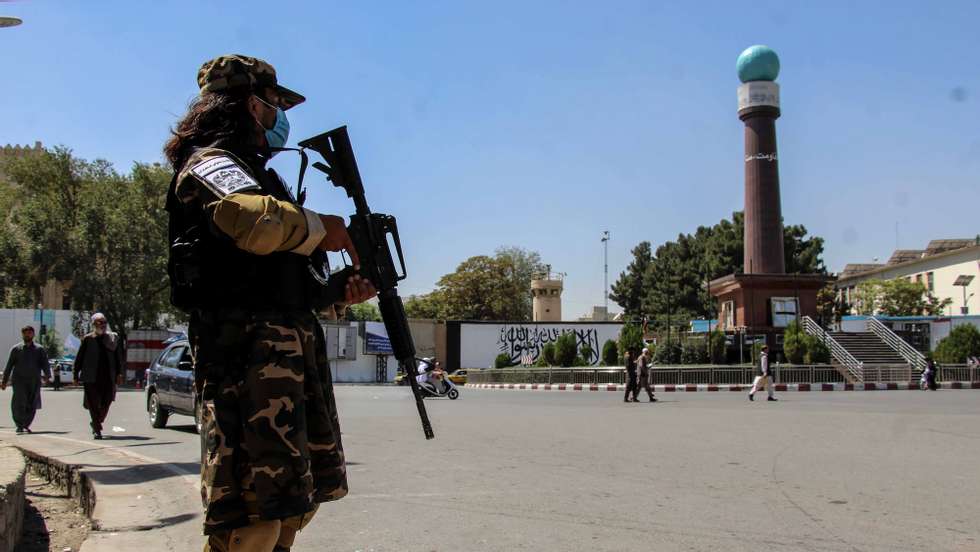 epa09455303 Taliban stand guard at a checkpoint in Kabul, Afghanistan, 08 September 2021. Hundreds of protesters on 08 September, came out on the streets of cities across Afghanistan to demand their rights, a day after the Taliban officially announced the formation of a new government consisting exclusively of fundamentalists from their ranks.  EPA/STRINGER