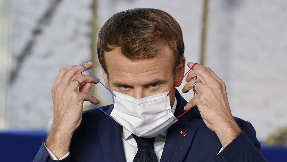 epa09553564 French President Emmanuel Macron adjusts his protective face mask at the start of the G20 World Leaders Summit at the convention center in Rome, Italy, 30 October 2021. Climate change and the relaunch of the global economy will top the G20 agenda as leaders of the world's most advanced nations meet October 30, the first in-person gathering since the pandemic.  EPA/LUDOVIC MARIN / POOL  MAXPPP OUT