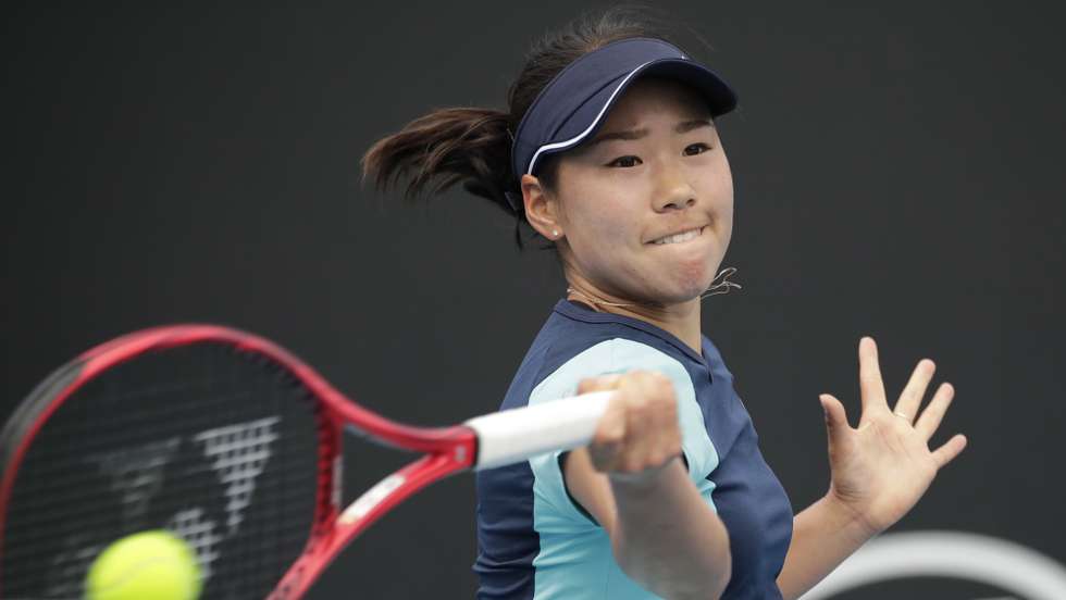 epa08145749 Nao Hibino of Japan in action during her women's singles first round match against Peng Shuai of China at the Australian Open Grand Slam tennis tournament in Melbourne, Australia, 21 January 2020. EPA/FRANCIS MALASIG