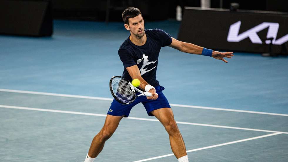 epa09683974 Novak Djokovic of Serbia in action during a practice session ahead of the Australian Open at Melbourne Park in Melbourne, Australia, 14 January 14 2022.  EPA/DIEGO FEDELE  AUSTRALIA AND NEW ZEALAND OUT
