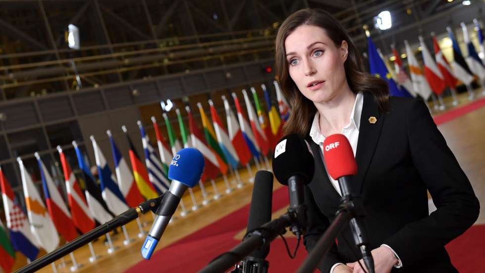 epa09781861 Finland's Prime Minister Sanna Marin speaks to the press as she arrives for an emergency European Union (EU) summit on the situation in Ukraine at the European Council building in Brussels, Belgium, 24 February 2022. A special meeting of the European Council was urgently convened to discuss the situation in Ukraine. Ahead of the summit, EU leaders issued a joint statement in which they 'condemn in the strongest possible terms Russia's unprecedented military aggression against Ukraine.'  EPA/JOHN THYS / POOL