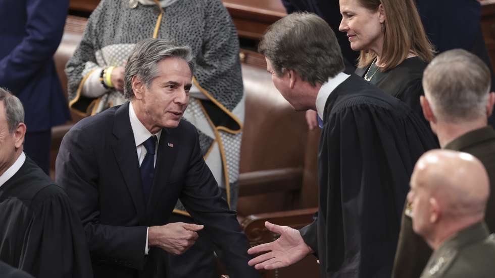 epa09795050 US Secretary of State Antony Blinken (L) talks to US Supreme Court Associate Justice Brett Kavanaugh prior to the State of the Union address during a joint session of Congress in the US Capitol's House Chamber, in Washington, DC, USA, 01 March 2022.  EPA/Win McNamee / POOL
