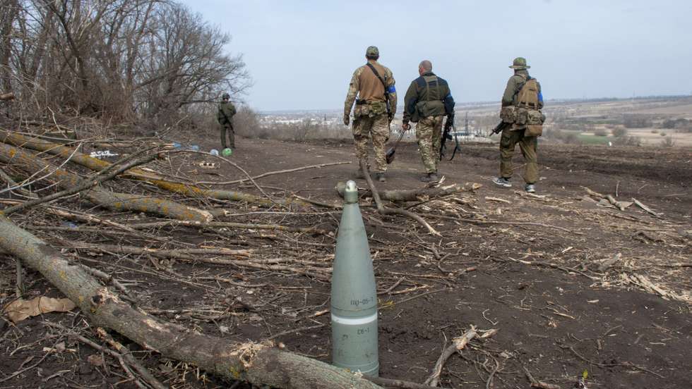 epa09863669 Ukrainian soldiers inspect destroyed Russian positions in the recaptured by the Ukrainian army Mala Rohan village, near Kharkiv, northeast Ukraine, 01 April 2022. Mala Rohan and the area around had recently been recaptured by the Ukrainian army from Russian forces. On 24 February Russian troops had entered Ukrainian territory in what the Russian president declared a 'special military operation', resulting in fighting and destruction in the country, a huge flow of refugees, and multiple sanctions against Russia.  EPA/VASILIY ZHLOBSKY