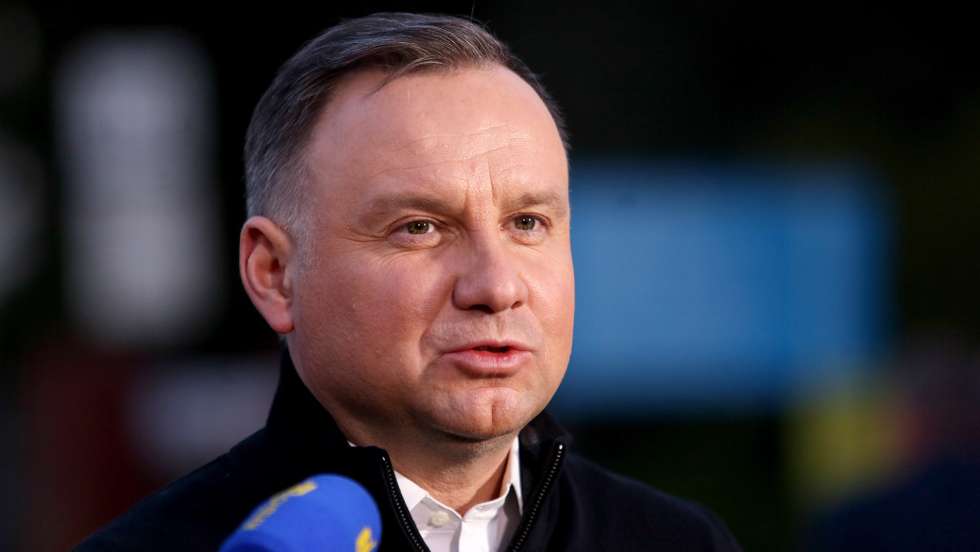 epa09904970 Polish President Andrzej Duda during a press conference in front of the Zofiowka coal mine in Jastrzebie-Zdroj, southern Poland, 23 April 2022. A tremor shook the Zofiowka coal mine in the early hours on 23 April, leaving ten miners missing, according to a statement by the mining conglomerate JSW, the mine owner. The tremor involved 'an intensive outflow of methane', JSW said. Twelve rescue teams have been trying to reach the missing miners. High concentration of methane may hinder the rescue operation as the pipeline supplying fresh air to the location has been damaged. A rescue operation is currently underway.  EPA/ZBIGNIEW MEISSNER POLAND OUT