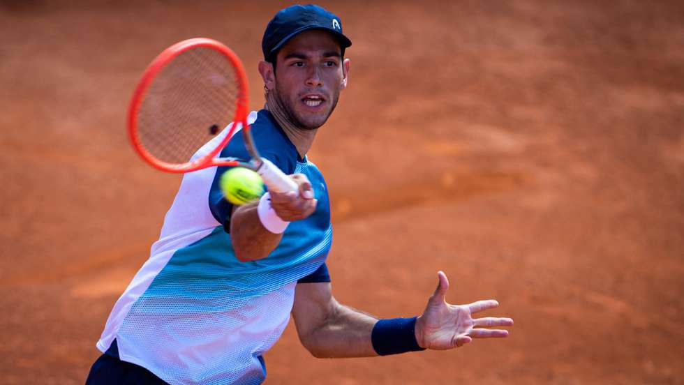 epa09912600 Portuguese tennis player Nuno Borges in action against USA player Frances Tiafoe during their eighth final match of the Estoril Open Tennis tournament, in Estoril, outskirts of Lisbon, Portugal, 27 April 2022.  EPA/JOSE SENA GOULAO