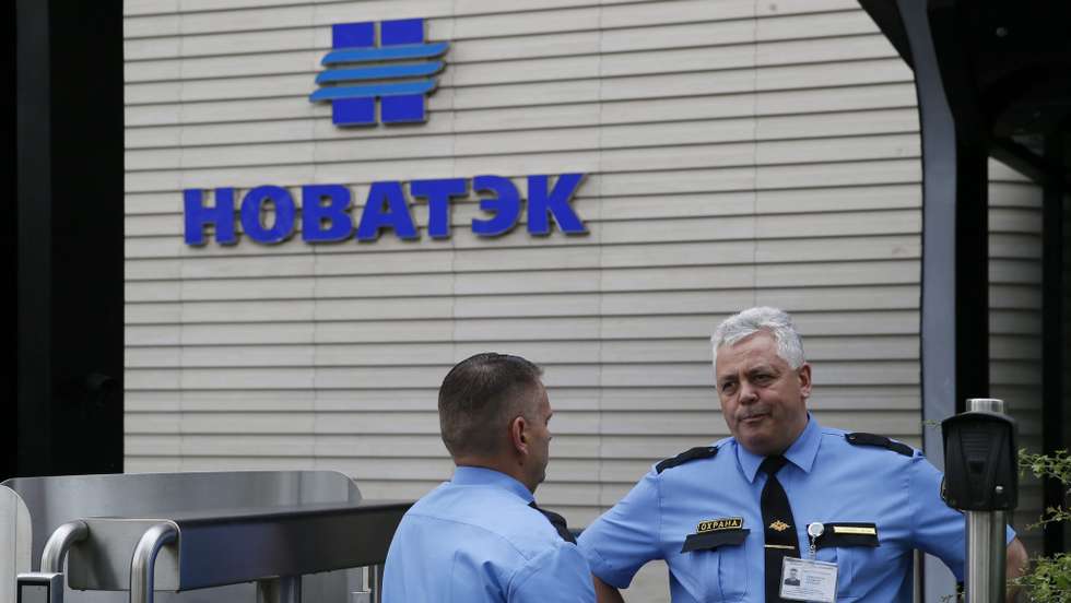 epa04319367 Security officers talk at the entrance to the Moscow office of Russia's major natural gas producer NOVATEK in Moscow, Russia, 17 July 2014. The United States has imposed a new package of Ukraine-related sanctions on Russian entities in defense, energy and banking sectors, including NOVATEK. Russia on 17 July reacted with outrage at the latest round of Western sanctions over the conflict in Ukraine while arguing that they would ultimately hurt the West more than itself. The Foreign Ministry in Moscow said the US measures are 'a primitive attempt at revenge because events in Ukraine are not developing according to its scenario,' the Foreign Ministry in Moscow said, adding that it reserves the right to retaliate.  EPA/YURI KOCHETKOV