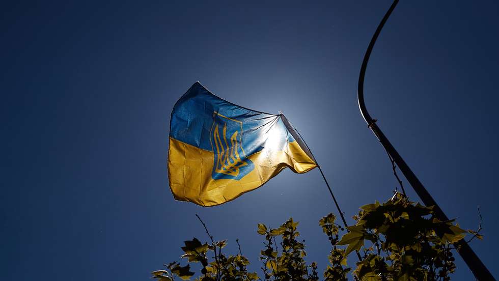 epa09906476 People with Ukrainian national flags take part in a demonstration against the Russian invasion of Ukraine, in front of the Russian embassy in Madrid, Spain, 24 April 2022. Russian troops invaded Ukraine on 24 February resulting in fighting and destruction in the country, and triggering a series of severe economic sanctions on Russia by Western countries.  EPA/Miguel Oses