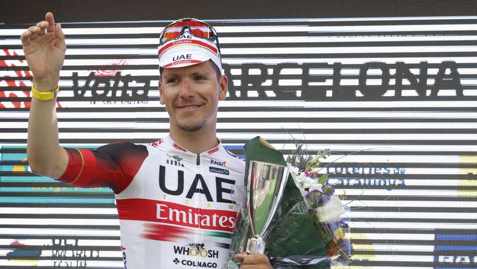 epa09852870 Portuguese rider Joao Almeida, of UAE Team Emirates celebrates his third place on the podium after the 7th and last stage of the Tour of Catalonia cycling race, over 138.6km in Barcelona, Spain, 27 March 2022, Spain.  EPA/Toni Albir