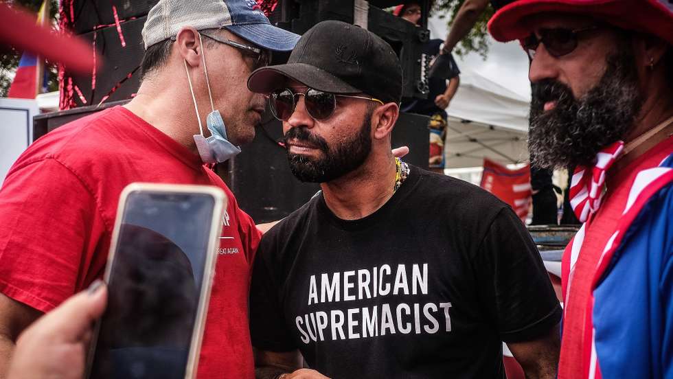 epa08985258 (FILE) - Far-right group the Proud Boys leader Enrique Tarrio (R) interacts with supporters during the 'Latinos for Trump' demonstration, at Tamiami Park in Miami, Florida, USA, 18 October 2020 (reissued 03 February 2021). Canada has labbeled the Far-right group the Proud Boys a terrorist group, Canadian public safety minister Bill Blair announced on 03 February 2021.  EPA/MARIO CRUZ