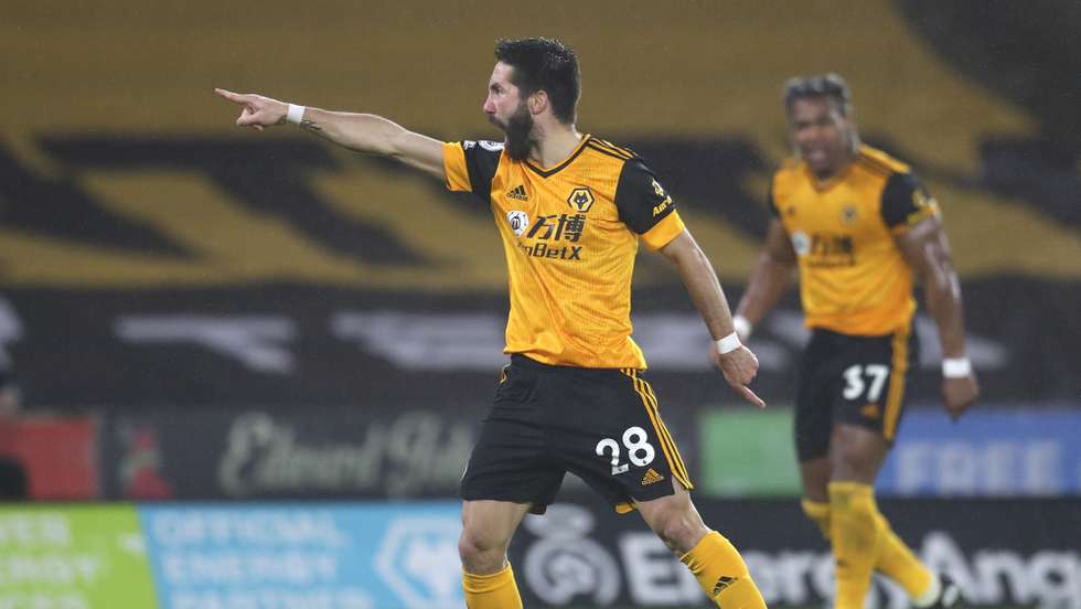 epa08982244 Joao Moutinho (L) of Wolverhampton reacts after scoring the 2-1 goal during the English Premier League soccer match between Wolverhampton Wanderers and Arsenal FC in Wolverhampton, Britain, 02 February 2021.  EPA/Catherine Ivill / POOL EDITORIAL USE ONLY. No use with unauthorized audio, video, data, fixture lists, club/league logos or 'live' services. Online in-match use limited to 120 images, no video emulation. No use in betting, games or single club/league/player publications.