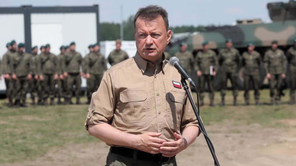 epa10036773 Deputy Prime Minister, Minister of National Defence Mariusz Blaszczak speaking to the media after a briefing on the situation on the Polish-Belarusian border, at a military encampment in the town of Nowa Luka, eastern Poland, 27 June 2022. Poland dealt with illegal imigration of Belarus, but Border security is especially following Russia's military invasion in Ukraine.  EPA/Artur Reszko POLAND OUT