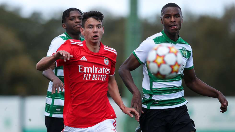 Sporting's Chico Lamba (R) in action against Benfica's Zan Jevsenak (C) during the UEFA Youth League quarter-final, between Sporting and Benfica, at Aurelio Pereira stadium in Alcochete, Setubal, Portugal, 13 April 2022. ANTONIO COTRIM/LUSA