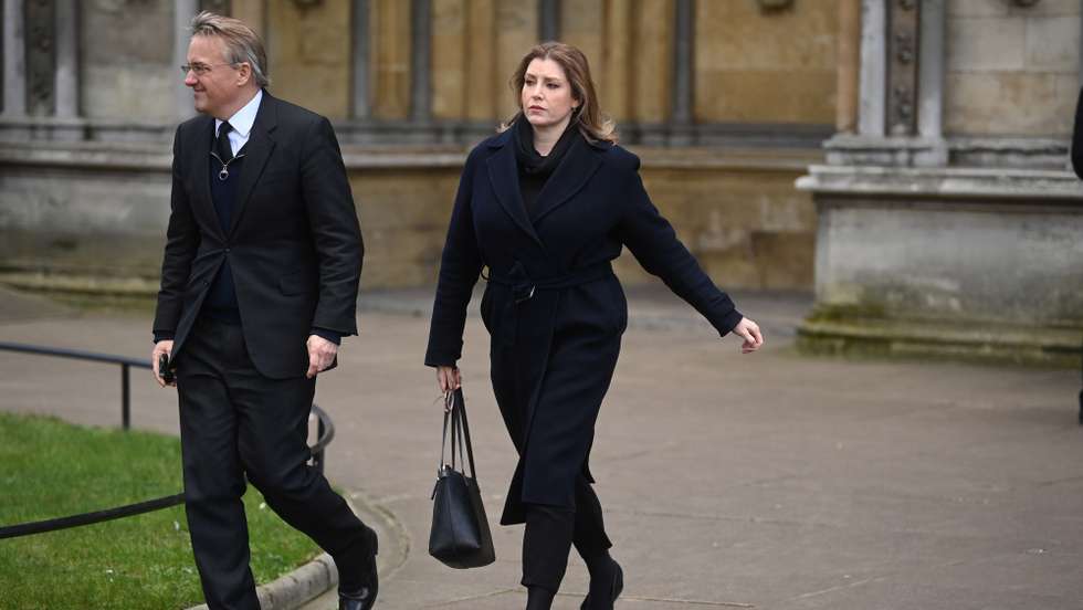 epa09720006 Conservative MP Penny Mordaunt (R) attends the funeral of Labour Party MP Jack Dromey at St Margret's Church in Westminster Abbey in London, Britain, 31 January 2022. Jack Dromey, was Member of Parliament for Birmingham Erdington and died at his flat in Birmingham on 07 January 2022.  EPA/NEIL HALL