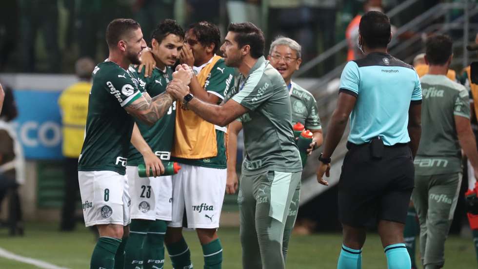 epa09798020 Ze Rafael (L) of Palmeiras celebrates after scoring with head coach Abel Ferreira (C) during the Recopa Sudamericana final soccer match between Palmeiras and Athletico Paranaense at the Allianz Parque Stadium in Sao Paulo, Brazil, 02 March 2022.  EPA/Sebastiao Moreira