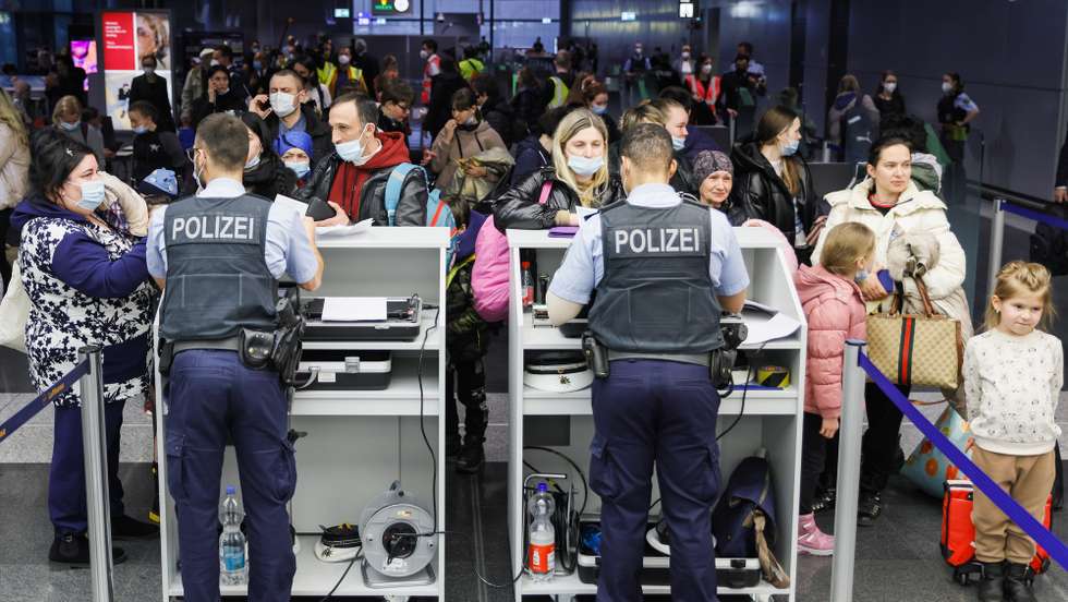 epa09849542 Passengers stand in line for entry procedures during the arrival of the first Ukrainian refugees coming from the Republic of Moldova by airplane at Frankfurt airport, in Frankfurt am Main, Germany, 25 March 2022. On 24 February Russian troops had entered Ukrainian territory in what the Russian president declared a 'special military operation', resulting in fighting and destruction in the country, a huge flow of refugees, and multiple sanctions against Russia. According to United Nations High Commissioner for Refugees (UNHCR) figures, more than 3.7 million Ukrainians have fled their country since Russia began its military invasion.  EPA/RONALD WITTEK / POOL