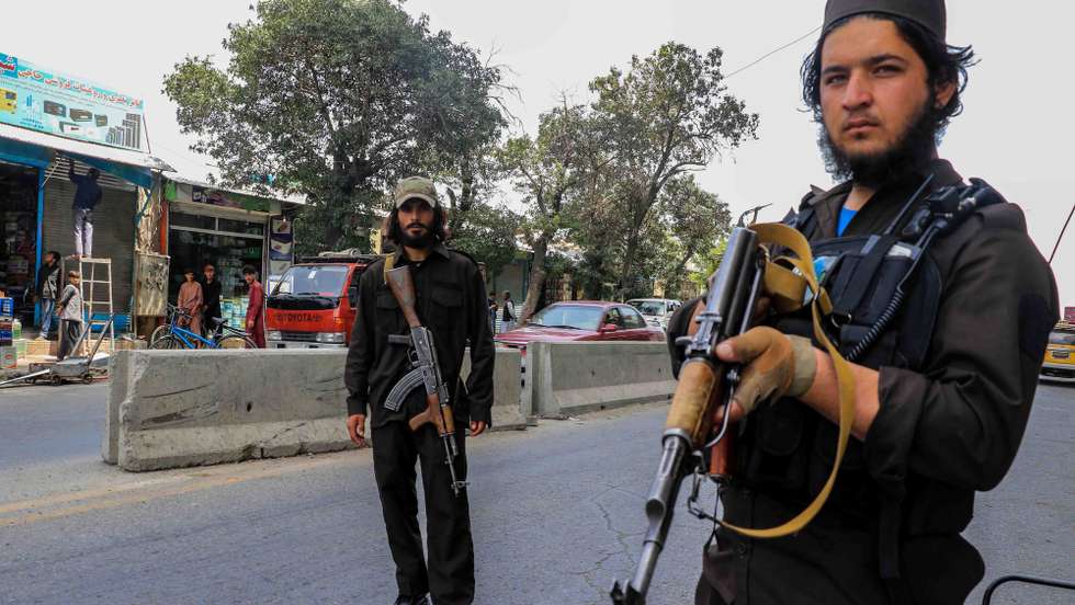 epa10127191 Armed members of Taliban stand gaurd near a Mosque that was damaged in a suicide bomb attack in Kabul, Afghanistan, 18 August 2022. At least 21 people were killed and another 33 injured in a recent suicide attack on a mosque in the Afghan capital, the police said 18 August. No armed group has claimed responsibility for the explosion although the Islamic State (IS) terror group, which is the biggest threat to the Taliban regime, usually claims responsibility for such attacks.  EPA/STRINGER