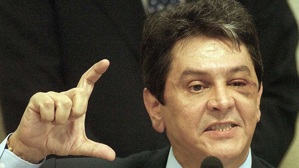 epa000470597 Brazilian congressman Roberto Jefferson testifies before a Special Committee of the Brazilian Congress, Thursday, 30 June 2005, in Brasilia, Brazil. The former ally of President Luiz Inacio da Silva made new accusations against the PT, as the president's Workers Party is known. Jefferson, who has already accused the governing party of bribing legislators from other parties to ensure their support for the government's agenda in Congress, said that the PT received each month the equivalent of $1.2 million in "surpluses" from the accounts of the state-owned electricity producer FCE.  EPA/Ana Nascimento