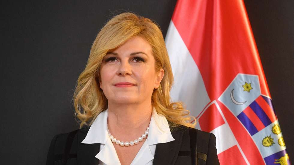 epa09973270 Former Croatian President Kolinda Grabar-Kitarovic is decorated with the highest Polish Order of the White Eagle by the Polish president Andrzej Duda, at the House of the Three Seas in Davos, Switzerland, 24 May 2022.  EPA/RADEK PIETRUSZKA POLAND OUT
