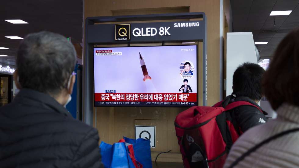epa10282967 People watch the news at a station in Seoul, South Korea, 03 November 2022. According to South Korea's Joint Chiefs of Staff (JCS), North launched an Intercontinental Ballistic Missile (ICBM) and two short-range into the East Sea.  EPA/JEON HEON-KYUN