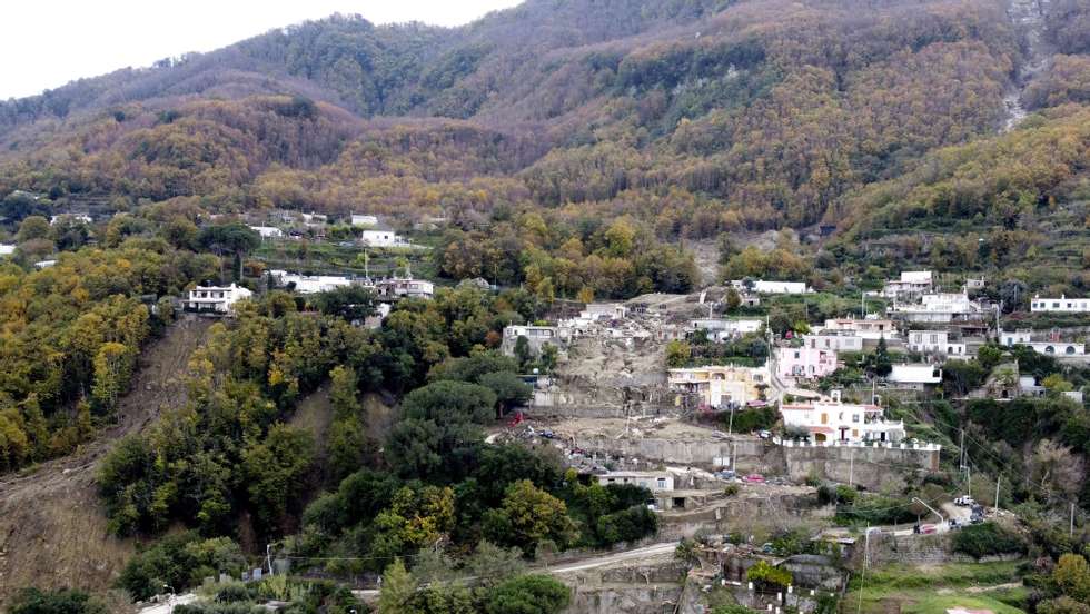 epa10338814 An aerial view of the area where search operations for the last missing victims of the landslide are underway, in Casamicciola, Ischia Island, Italy, 30 November 2022. Italy has declared state of emergency following a landslide on Ischia Island which until now has left eight people dead and four missing. An infant and two children are among the confirmed victims of the disaster. Four other people were injured and 230 stayed homeless after a massive avalanche of mud and debris hit the town of Casamicciola Terme following intense rain.  EPA/CIRO FUSCO ITALY OUT