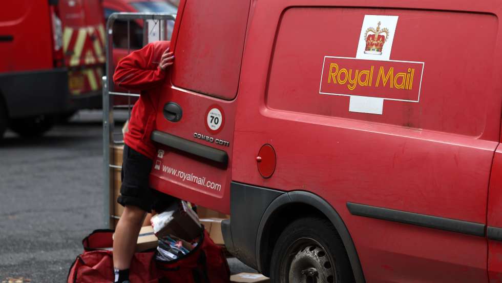 epa11376982 A Royal Mail worker at a Royal Mail depot in High Wycombe, Buckinghamshire, Britain, 29 May 2024. The boards of directors of EP UK Bidco Limited and International Distribution Services plc (IDS) confirmed that they have reached agreement on the sale of the British Royal Mail to Czech billionaire Daniel Keetinske in a deal worth 5.2bn British pounds.  EPA/ANDY RAIN