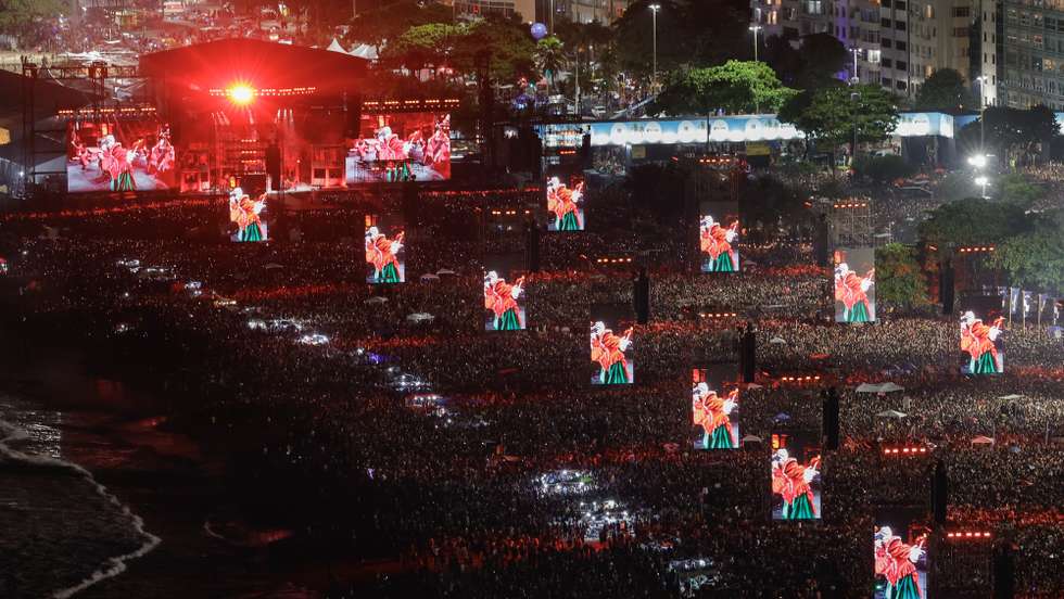 epa12072308 Displays show American singer and songwriter Lady Gaga performing during a free mega concert at Copacabana beach in Rio de Janeiro, Brazil, 03 May 2025.  EPA/ANDRE COELHO
