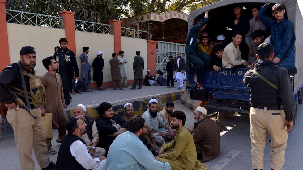 epa12787698 Alleged undocumented migrants and Afghan refugees sit inside a vehicle after being arrested during a police search operation following the cross-border clashes between Pakistan and Afghanistan, in Peshawar, Pakistan, 01 March 2026. Afghanistan has requested dialogue with Pakistan following days of intense military escalation triggered by a Taliban ground offensive in response to Pakistani airstrikes. Despite calling for negotiations, the Taliban launched further strikes on Pakistani military sites after Islamabad’s bombings in Kabul, Kandahar and Paktia. Casualty claims from both sides remain disputed, with no independent verification.  EPA/ARSHAD ARBAB