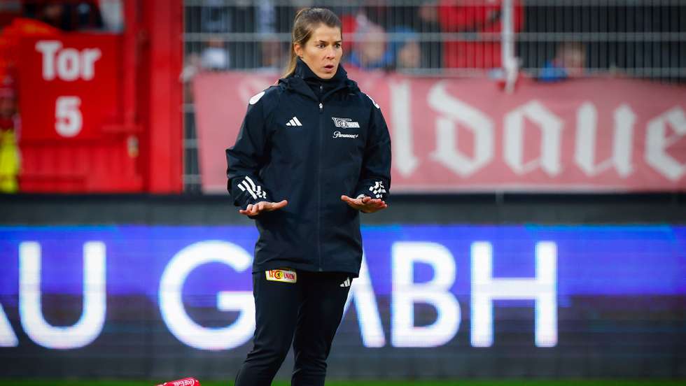epa10994404 Union's assistant coach Marie-Louise Eta reacts during the warm-up ahead of the German Bundesliga soccer match between Union Berlin and FC Augsburg in Berlin, Germany, 25 November 2023. Eta is the first female assistant coach in Bundesliga history.  EPA/HANNIBAL HANSCHKE CONDITIONS - ATTENTION: The DFL regulations prohibit any use of photographs as image sequences and/or quasi-video.