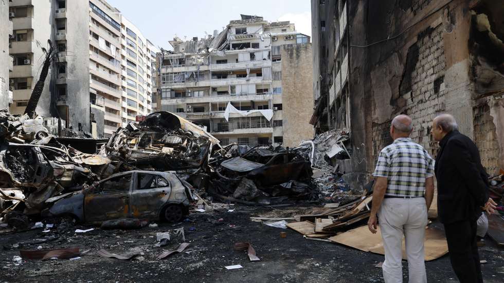 epa12887086 People inspect the wreckage of cars in Corniche el Mazraa, one of the areas hit during a massive wave of Israeli airstrikes on 08 April, in Beirut, Lebanon, 13 April 2026. According to the Lebanese Ministry of Public Health, Israeli attacks across Lebanon have killed at least 2,055 people and injured more than 6,588 others since the start of renewed hostilities between Israel and Hezbollah on 02 March 2026.  EPA/WAEL HAMZEH