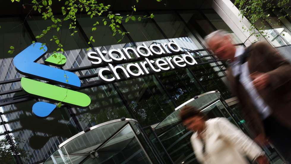 epa11388715 People walk by in front of the Standard Chartered headquarters in London, Britain, 04 June 2024. One of Britain's largest banks Standard Chartered has been hit by whistleblower allegations that it was involved in transactions worth some 100 billion US dollars, which the bank used to finance terrorist groups around the world. The claims relate to transactions the UK bank made between 2008 and 2013 that indicate sanctions against Iran may have been broken.  EPA/ANDY RAIN