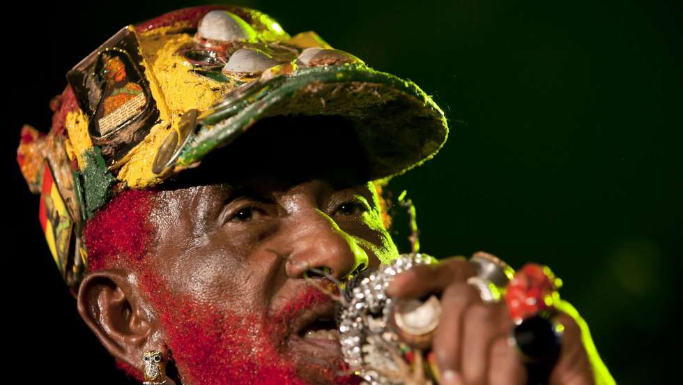 epa02565285 A picture made available on 05 February 2011 shows Jamaican musician Lee 'Scratch' Perry performing at Duerer Garden in Budapest, Hungary, 04 February 2011. The 75-year-old artist used to be a co-author and co-producer working with Bob Marley and the Wailers in the 1970s.  EPA/BALAZS MOHAI HUNGARY OUT
