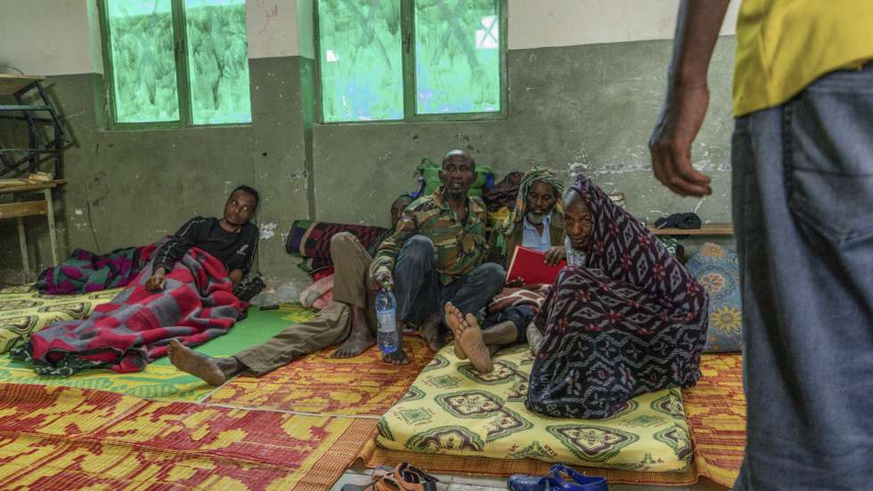 epa09421573 Ethiopian Internally Displaced Peoples (IDP's) who fled the fighting in the Tigray region take shelter in a make-shift IDP camp at a school in Dessie, Ethiopia, 19 August 2021 (20 August 2021). According to Dessie government communications officer Mesaye Kider, 55,000 Ethiopians have fled from war torn Tigray region in the north and are taking shelter in makeshift camps. This occurred as the Tigray Peoples Liberation Front (TPLF) captured Alamata and Kobo area's in the war that has been going on with Ethiopia's national military.  EPA/STR