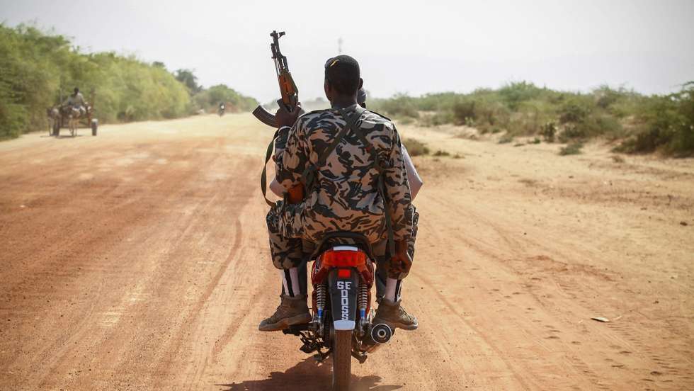 epa03917664 YEARENDER 2013 JANUARY
An armed soldier from Mali rides on the back of a scooter outside the recently liberated town of Diabaly, Mali, 23 January 2013.  EPA/NIC BOTHMA