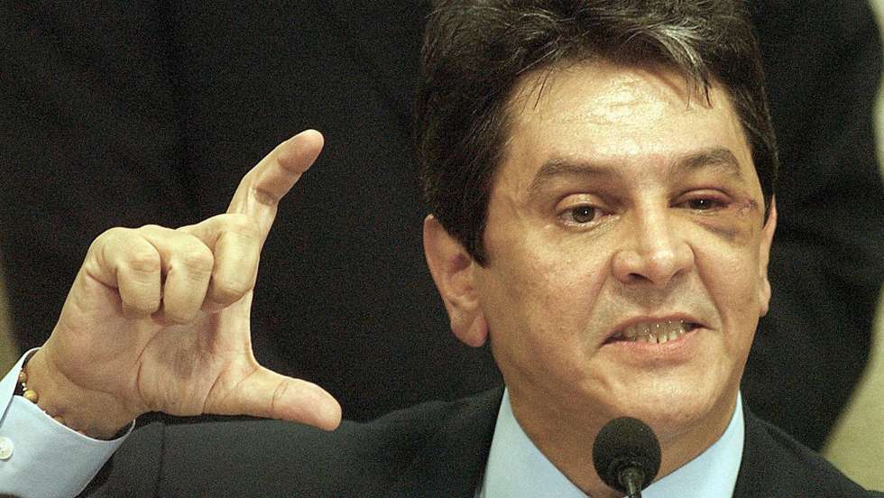 epa000470597 Brazilian congressman Roberto Jefferson testifies before a Special Committee of the Brazilian Congress, Thursday, 30 June 2005, in Brasilia, Brazil. The former ally of President Luiz Inacio da Silva made new accusations against the PT, as the president's Workers Party is known. Jefferson, who has already accused the governing party of bribing legislators from other parties to ensure their support for the government's agenda in Congress, said that the PT received each month the equivalent of $1.2 million in "surpluses" from the accounts of the state-owned electricity producer FCE.  EPA/Ana Nascimento