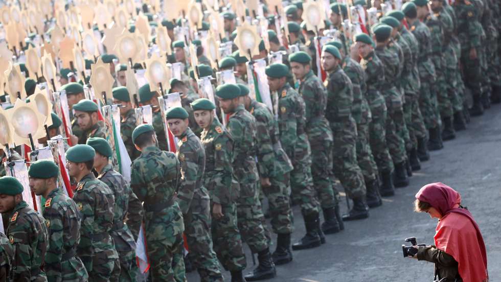 epa06676257 A foreign journalist works during a military parade marking the annual National Army Day in Tehran, Iran, 18 April 2018. Media reported that following the recent development in the region Rouhani said that Iran did not want tension but if necessary, the Iranian forces would be prepared to defend the countrie's borders.  EPA/ABEDIN TAHERKENAREH