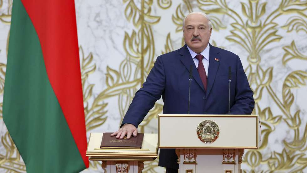 epa11986861 A handout photo made available by the Press Service of the President of the Republic of Belarus shows Belarusian President Alexander Lukashenko taking the presidential oath by placing his hand on the Belarussian Constitution during an inauguration ceremony at the Palace of Independence in Minsk, Belarus, 25 March 2025. Lukashenko, elected President of Belarus for a seventh term in elections last January, officially took office.  EPA/BELARUS PRESIDENT PRESS SERVICE HANDOUT -- MANDATORY CREDIT -- HANDOUT EDITORIAL USE ONLY/NO SALES