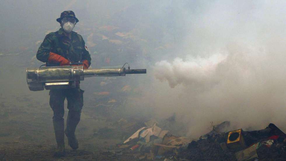 epa000348451 Indonesian army medical team sprays anti mosquito smoke in Banda Aceh on Sumatera Island, Indonesia on Monday,  17 January 2005. Foreign NGO's and Indonesian health department officers regularly spray anti mosquito smoke to prevent malaria and dengue fever around refugee camp and public places in Aceh. Indonesia was the hardest hit country by the Dec 26 tsunami, with an estimated 387,000 people left homeless in the devastated province of of Aceh.The death toll in Indonesia alone is expected to rise to more than 100,000.  EPA/AHMAD YUSNI