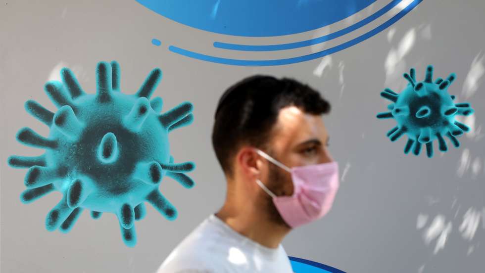 epa08665936 An Israeli wearing a protective face mask leaves after giving swab samples at a test station by Medical team of Maccabi Health Services in Jerusalem, Israel, 13 September 2020. The rate of morbidity and spread of the coronavirus led to new government restrictions aimed to prevent the spread of the coronavirus and COVID-19 disease outbreak. EPA/ABIR SULTAN EPIDEMIC &amp; PLAGUE