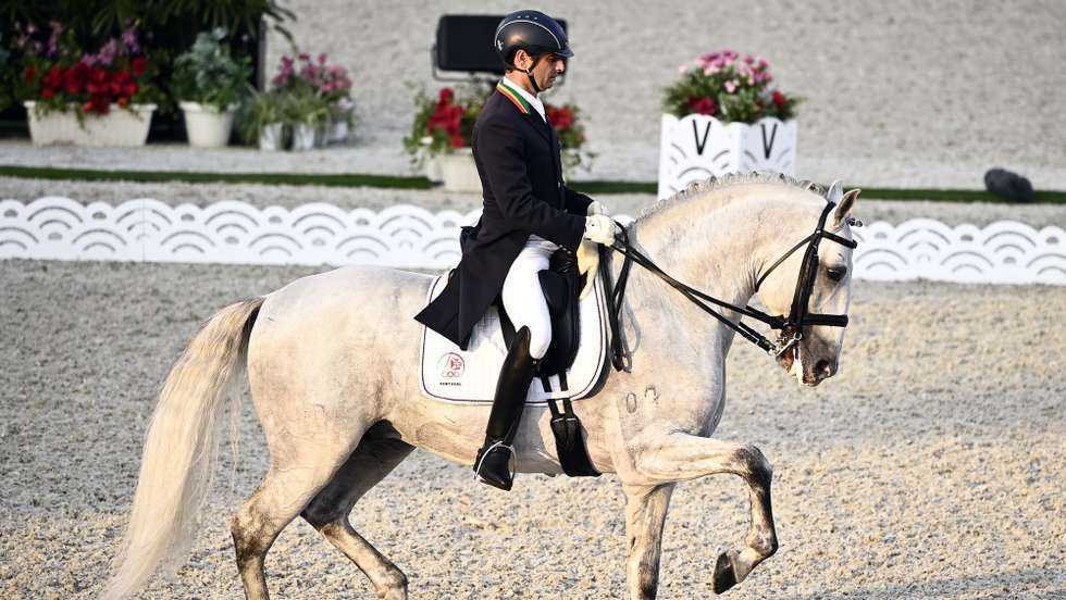 epa09373193 Rodrigo Torres of Portugal riding Fogoso competes in the Grand Prix Freestyle Individual Final during the Equestrian events of the Tokyo 2020 Olympic Games at the Baji Koen Equestrian Park in Setagaya, Tokyo, Japan, 28 July 2021.  EPA/CHRISTIAN BRUNA