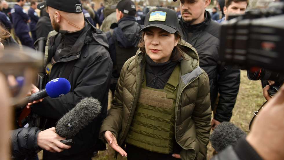 epa09885929 Prosecutor General of Ukraine Iryna Venediktova speaks to journalists during a visit to a mass grave in Bucha, Kyiv (Kiev) area, Ukraine, 12 April 2022. Forensic investigators began exhuming a mass grave in Bucha containing more than 410 bodies of civilians, according to Ukrainian officials. The UN Human Rights Council has decided to launch an investigation into the violations committed after Russia's full-scale invasion of Ukraine, the Ukrainian Parliament reported. Russian troops entered Ukraine on 24 February resulting in fighting and destruction in the country and triggering a series of severe economic sanctions on Russia by Western countries.  EPA/OLEG PETRASYUK