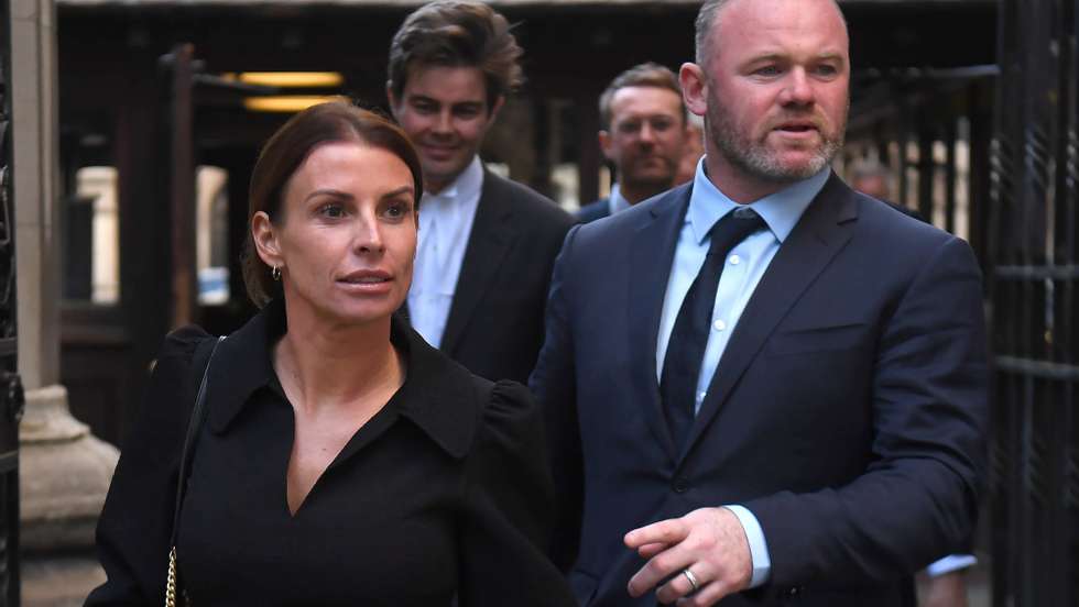 epa09953229 Coleen Rooney (L) and her soccer manager husband Wayne Rooney (R) depart the Royal Courts of Justice in London, Britain, 17 May 2022.  Footballers&#039; wives Coleen Rooney and Rebekah Vardy are facing each other in the High Court at the opening of their &#039;Wagatha Christie&#039; libel trial over a social media post. The case centres on Twitter and Instagram posts from October 2019 where Coleen Rooney alleged that someone had leaked stories to The Sun tabloid.  EPA/NEIL HALL