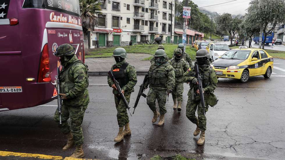 epa11072365 Ecuadorian military personnel patrol during a control operation in Quito, Ecuador, 12 January 2024. Following a string of prison riots, Ecuadorian President Daniel Noboa on 08 January declared a state of exception, and said that government forces were engaged in an 'internal armed conflict' with armed criminal gangs, allowing him to use the Army and not just the Police to counter the violence. Ecuador has been experiencing a security crisis and extreme violence since ten people were killed in different attacks, which included the temporary takeover of a television station by an armed group in Guayaquil, the burning of cars, and threats against universities, government institutions, and businesses. The security of Guayaquil and four other cities in the coastal province of Guayas, one of the epicenters of the violence crisis, is being reinforced with the presence of more police and military.  EPA/JOSE JACOME