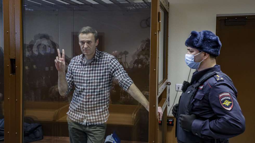 epa09108968 (FILE) Russian opposition leader Alexei Navalny gestures inside a glass cage prior to a hearing at the Babushkinsky District Court in Moscow, Russia, 20 February 2021 (reissued 31 March 2021). Russian opposition leader Alexei Navalny, who serves his 2,5 years sentence in a prison colony in the town of Pokrov in the Vladimir region, announced he is going on hunger strike in a protest of mistreatment in the prison.  EPA/YURI KOCHETKOV *** Local Caption *** 56711412