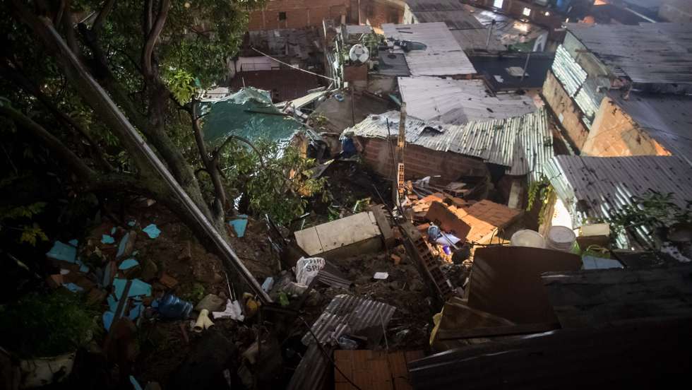 epa10263969 A house was damaged after a landslide occured in the wake of heavy rains in Caracas, Venezuela, 24 October 2022. Twelve houses were affected and at least 60 are at risk due to heavy rains, Venezuelan Interior Minister Remigio Ceballos said.  EPA/MIGUEL GUTIERREZ