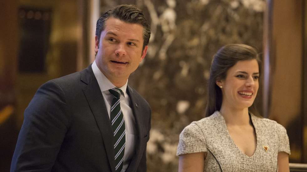 epa05677061 Pete Hegseth (L), a reported contender for the position of Veterans Affairs Secretary, walks in the lobby of Trump Tower in New York, New York, USA, 15 December 2016.  EPA/Albin Lohr-Jones / POOL
